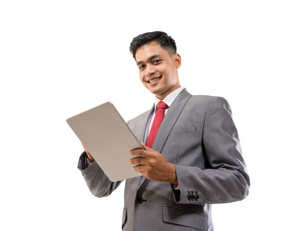 Empresario celebración tableta pc aislado sobre fondo blanco — Foto de Stock