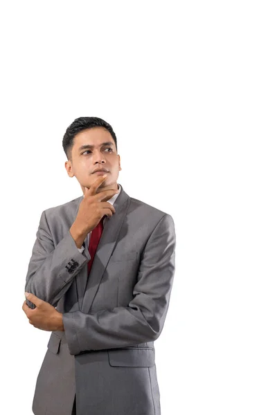 Businessman thinking while looking up to copyspace — Stock Photo, Image