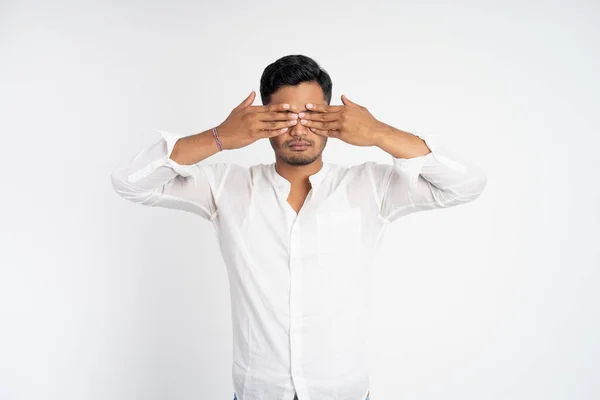 Man with uncomfortable expression with two hands covering eyes — Stock Photo, Image
