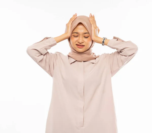 Frustrated Asian woman in hijab holding head with headache — Stock Photo, Image