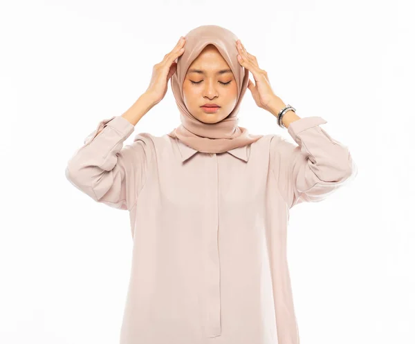 Frustrated Asian woman in hijab holding head with headache — Stock Photo, Image