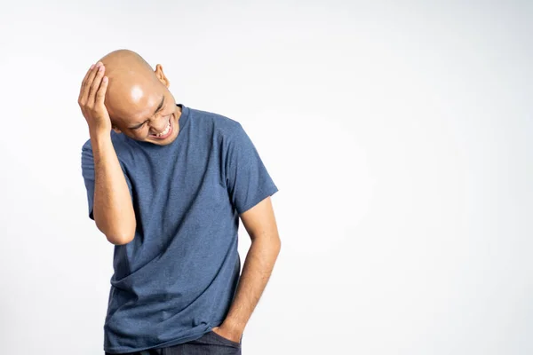 Bald man laughing holding his bald head — Stock Photo, Image