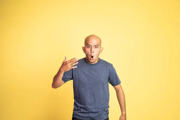 Asian bald man opening his mouth with spiciness expression — Stock Photo, Image