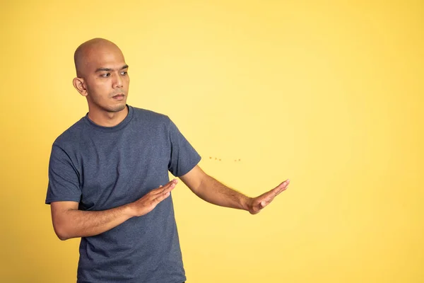 Asian bald young man rejecting offer with both palms — Stock Photo, Image