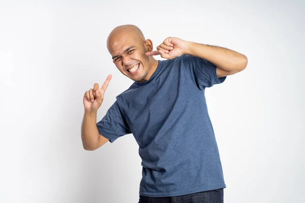 Asian bald man laughing with finger gestures pointing cheek — Stock Photo, Image