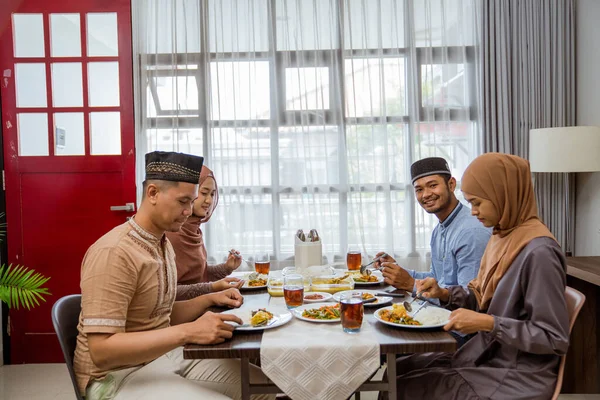 Asian muslim friend and family break fasting together — ストック写真