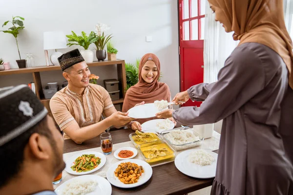 Asian muslim friend and family break fasting together — ストック写真