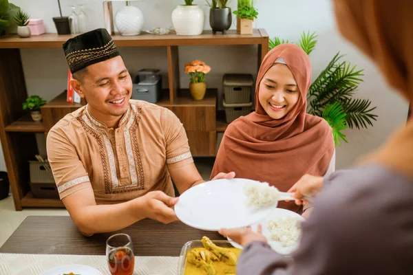 Serving food for friend for iftar dinner or eid mubarak — Stock Photo, Image