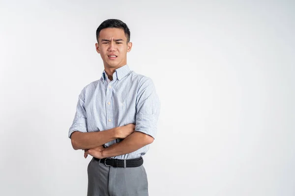 Asian young man with disgusting expression isolated over white background — Stock Photo, Image