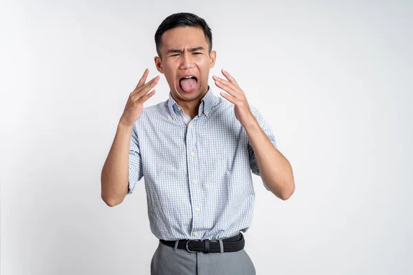 Asian young man with disgusting expression isolated over white background — Stock Photo, Image