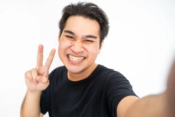 Happy asian man taking selfie with phone camera — ストック写真