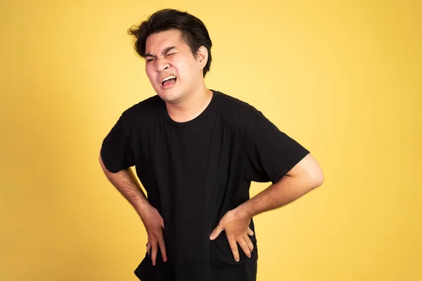 Man having stomachache holding his stomach with two hands — Stock Photo, Image