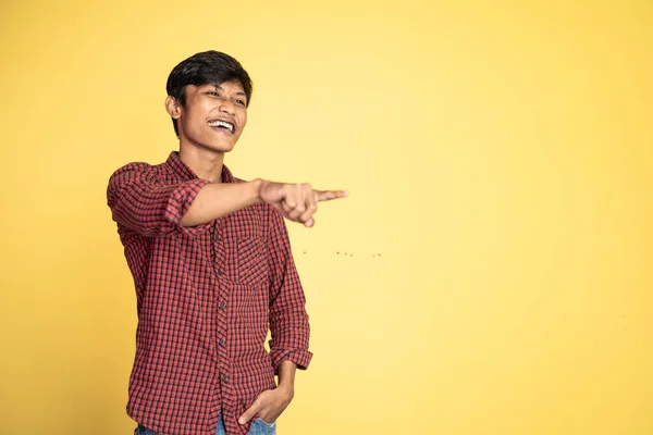 Man opens mouth wide while laughing with fingers pointing — Stock Photo, Image