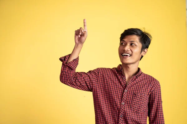 Asian businessman thinking something and pointing up — Stock Photo, Image