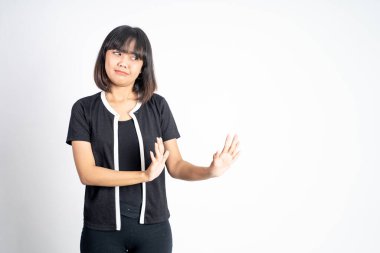 woman refusing with both palms gesture over isolated background