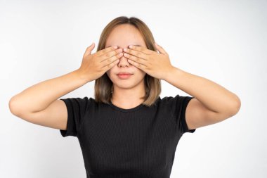 woman closing eyes with both palms on isolated background