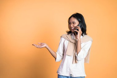 Asian girl with hand gesture presenting something on isolated
