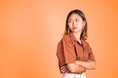 serious expression portrait of young asian woman over isolated background
