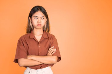 woman stand cross hand with unhappy sad face on isolated