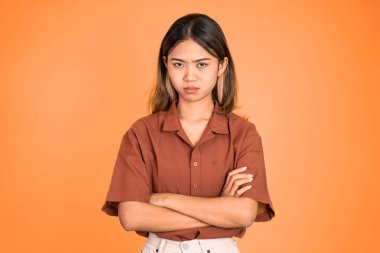 woman stand cross hand with unhappy sad face on isolated