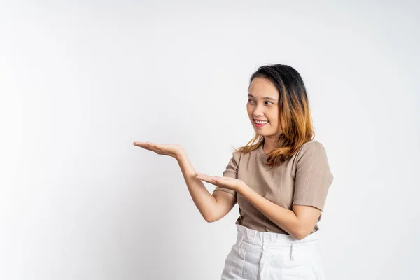 Asian girl with hand gesture presenting something on isolated — Foto de Stock