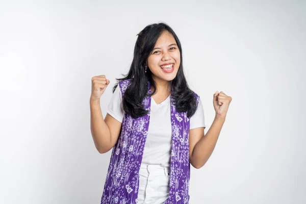 Asian woman clenching hands while celebrating success — Stockfoto