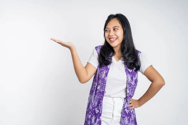 Asian girl with hand gesture presenting something on isolated — Foto Stock