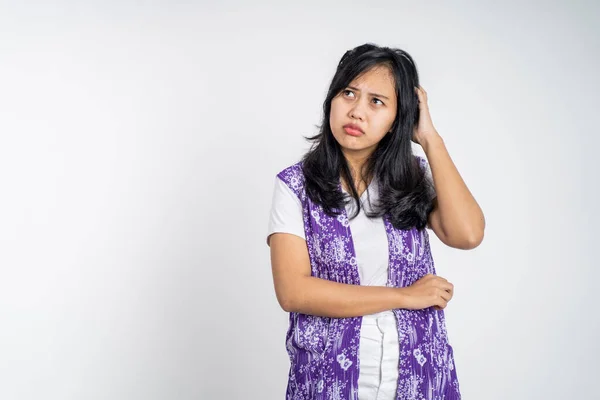 Beautiful woman on isolated background with thoughtful expression — ストック写真