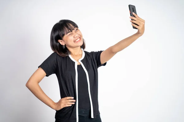 Beautiful young asian woman take selfie portrait using smartphone — Foto Stock