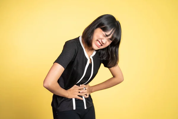 Woman having her period holding her stomach in pain — Stok fotoğraf