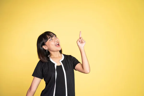 Woman with finger pointing up hand gesture on isolated background — Stock Photo, Image