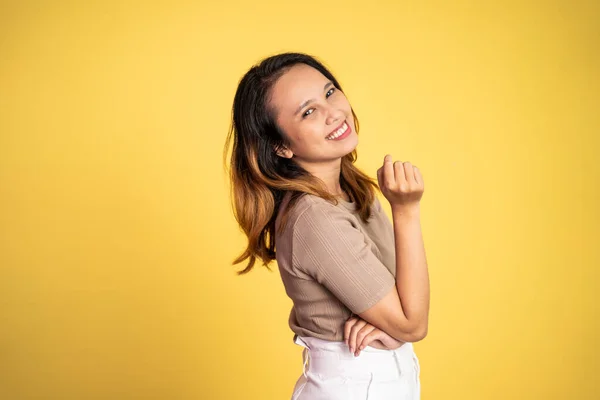 Asian ethnicity female looking at camera smiling with fun gesture — Stockfoto