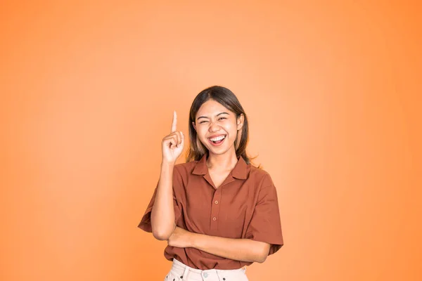 Woman with finger pointing up hand gesture on isolated background — Foto de Stock