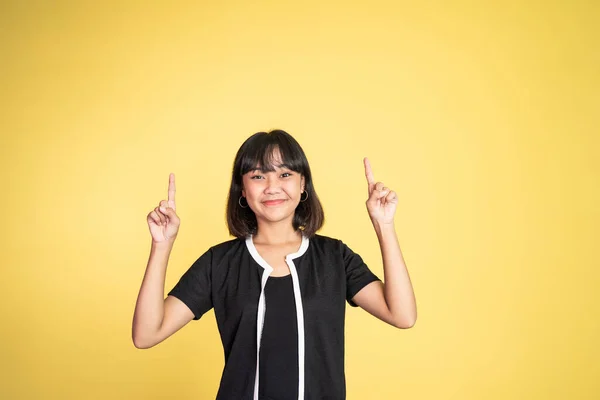 Woman with finger pointing up hand gesture on isolated background — Stock Fotó