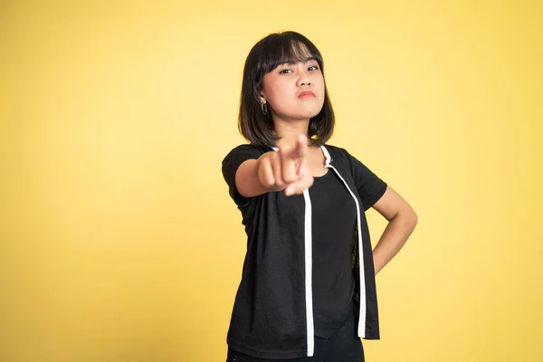 Angry asian woman with finger pointing to camera — Stockfoto