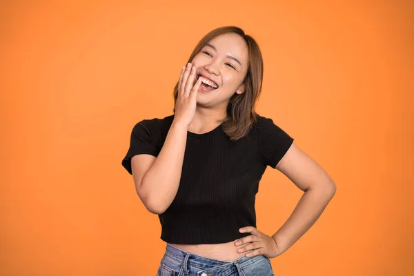 Excited beautiful woman feeling joy laughing on isolated background — Stockfoto