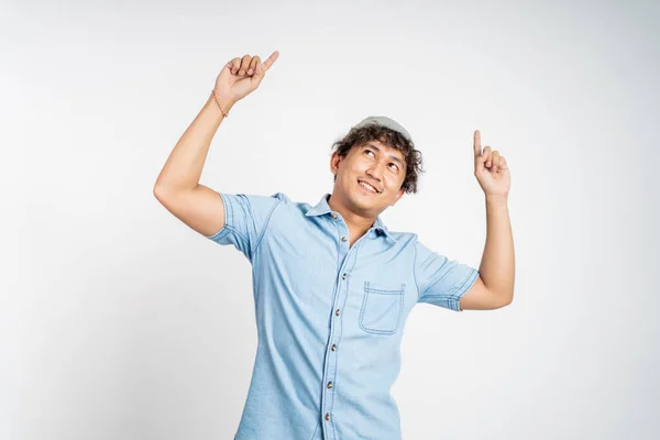 Smiling man with finger pointing up on isolated background — Stock Photo, Image
