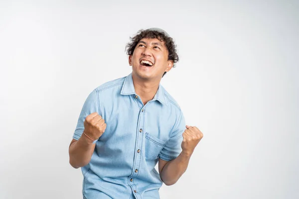 Happy excited young man over isolated background — Foto de Stock