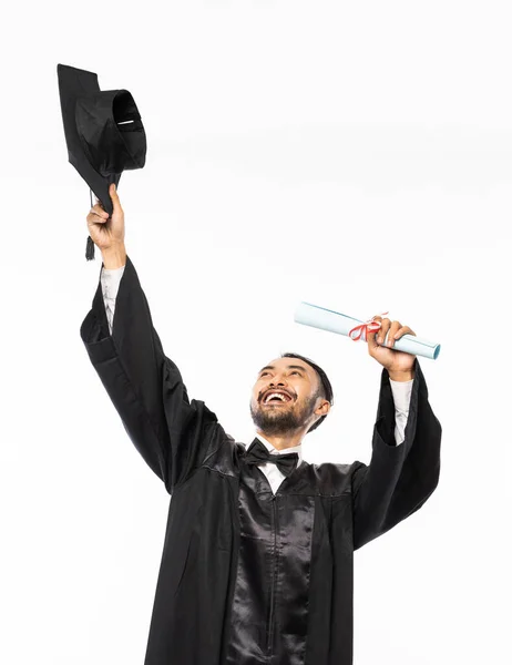 Happy Graduate Black Toga Holding His Hat Isolated Background — Stok fotoğraf