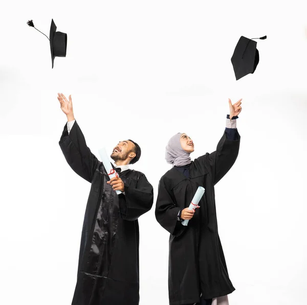 Couple Graduate Students Wearing Black Toga Holding Blackboard Hat Standing — Φωτογραφία Αρχείου