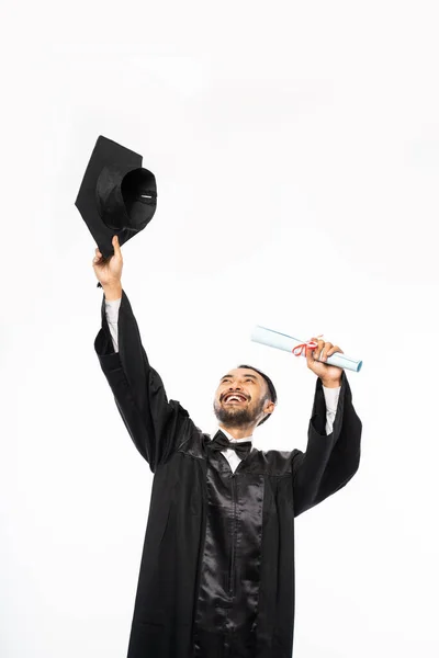 Happy Graduate Black Togas Holding Toga Hat Isolated Background — Stok fotoğraf