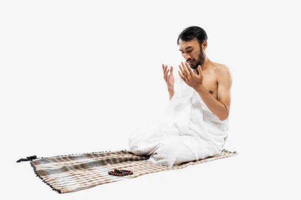 Asian Man Wearing Ihram Clothes Praying Prayer Rug Isolated Background — Stock Photo, Image