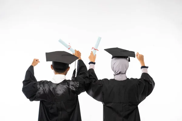 Rear View Two Graduate Students Wearing Togas Holding Diplomas Clenched — Stok fotoğraf