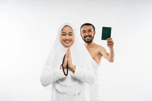 Husband Wife Wearing Ihram Clothes Holding Passport Greeting Gesture Isolated — стоковое фото