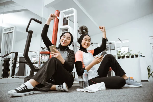 Excited Muslim Sporty Woman Taking Break Exercising Gym Sitting Floor — Photo