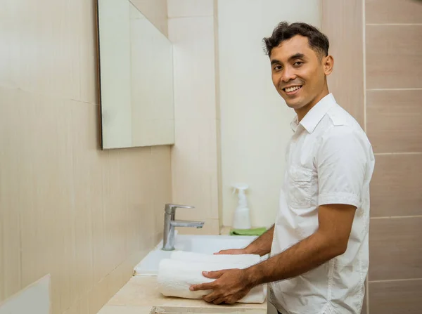 Smiling Asian Male Janitor Putting Towel Sink Bathroom — Fotografia de Stock