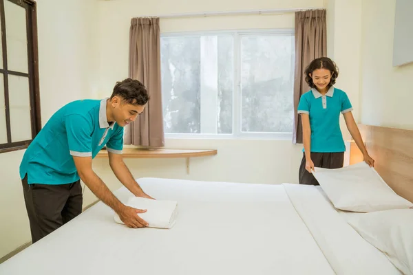 Male Female Cleaners Wearing Uniforms Making Beds Hotel Rooms — стоковое фото