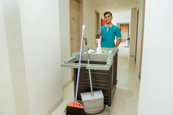 Housekeepers Thumbs Pushing Carts Filled Cleaning Supplies Hotel Hall — стоковое фото