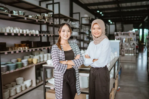 Two Beautiful Asian Girls Smiling While Standing Hands Crossed Houseware — Stockfoto