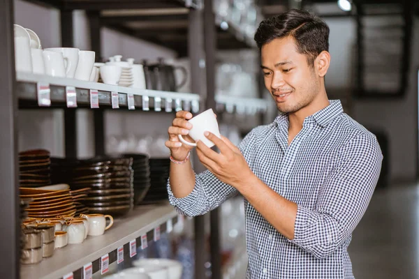 Asian Man Shop Owner Holding Ceramic Cup Shelf Homeware Store — ストック写真
